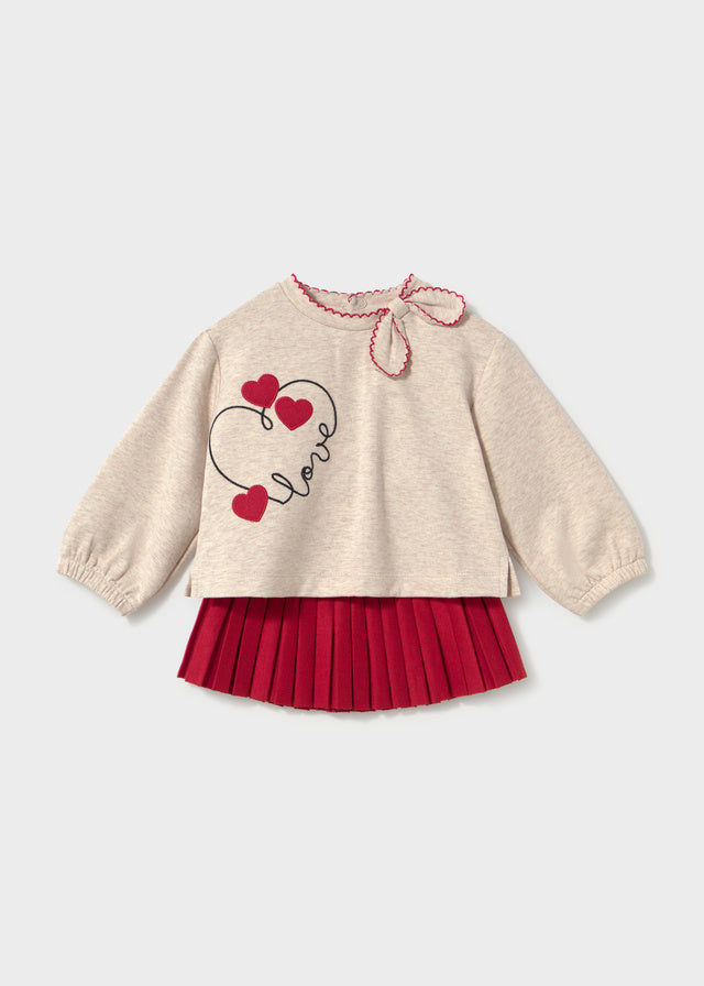 Conjunto sudadera corazones y falda plisada bebé
